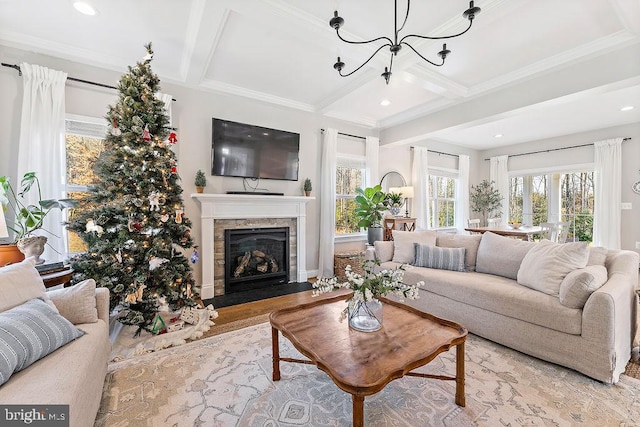 living room with coffered ceiling, ornamental molding, beamed ceiling, light hardwood / wood-style floors, and a chandelier