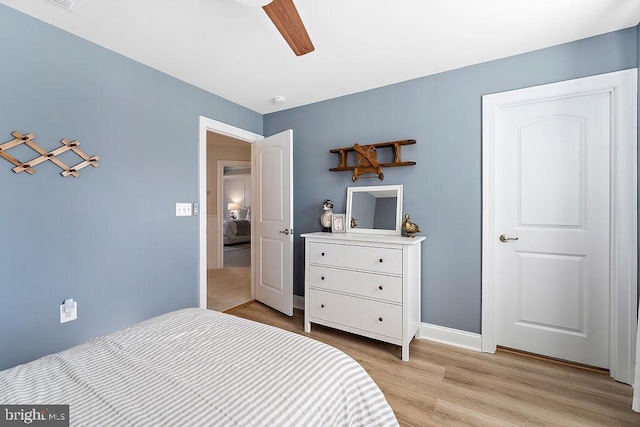 bedroom featuring ceiling fan and light wood-type flooring