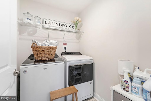 laundry room with washing machine and clothes dryer