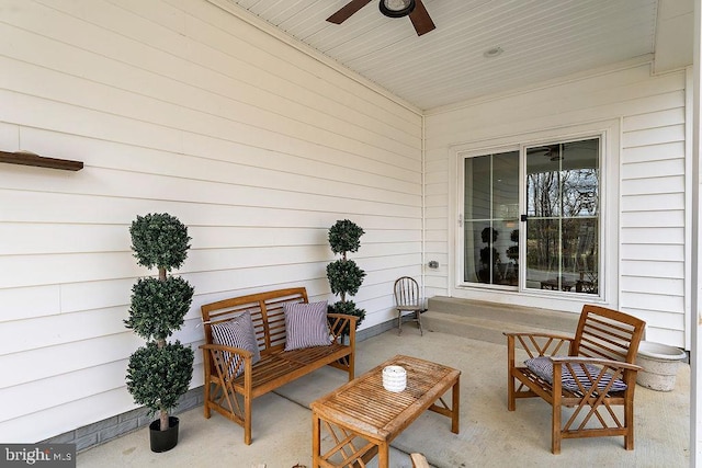 view of patio / terrace with ceiling fan and an outdoor living space