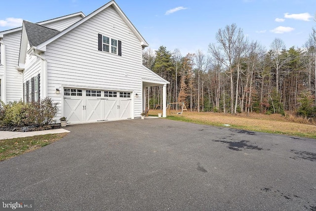 view of side of property with a garage