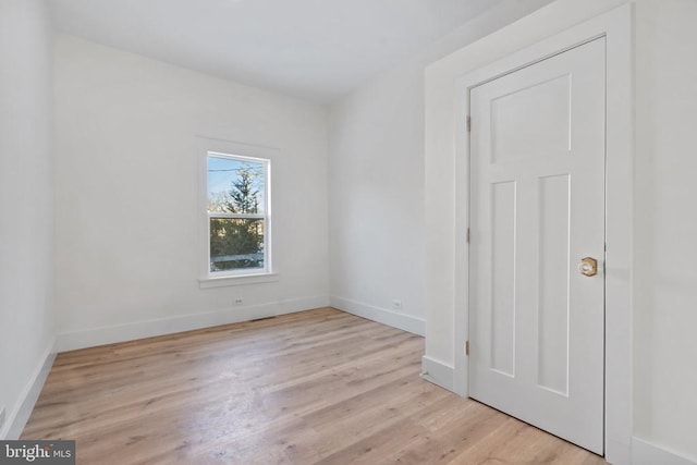 unfurnished room featuring light wood-type flooring