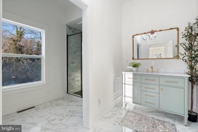 bathroom with vanity and an enclosed shower