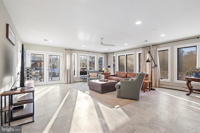 living room with ceiling fan and french doors