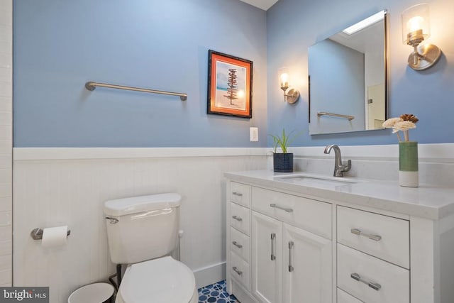 bathroom featuring toilet and vanity