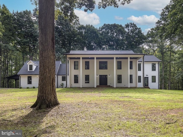 greek revival inspired property featuring a front yard