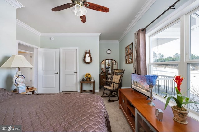 bedroom featuring ceiling fan, ornamental molding, and light colored carpet