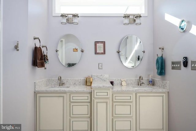 bathroom featuring a skylight and vanity