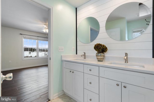 bathroom featuring ceiling fan and vanity