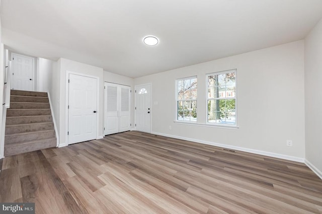 unfurnished room with light hardwood / wood-style flooring