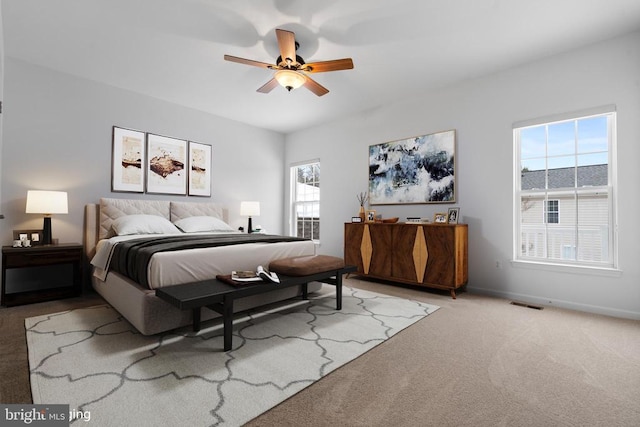 carpeted bedroom featuring ceiling fan