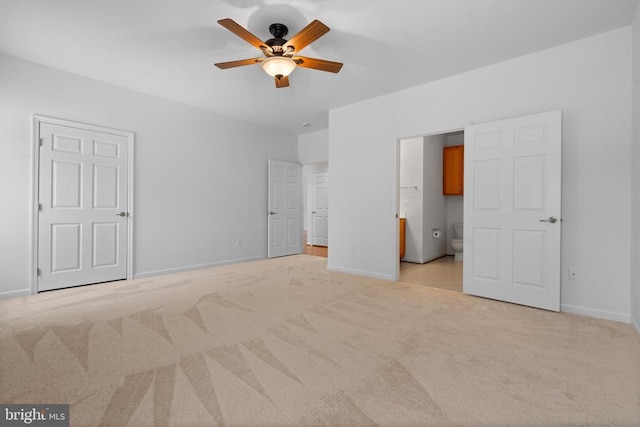 unfurnished bedroom featuring light carpet and ceiling fan