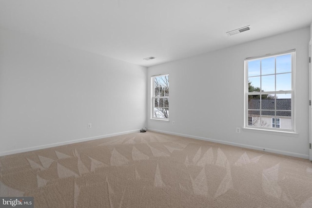 spare room with light carpet