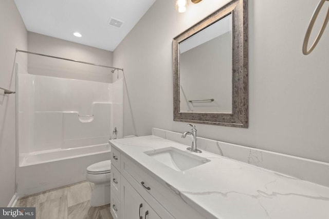 full bathroom featuring toilet,  shower combination, and vanity