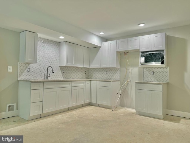 kitchen with sink and white cabinets