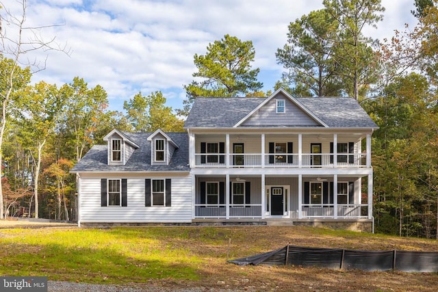 view of front facade with covered porch and a balcony