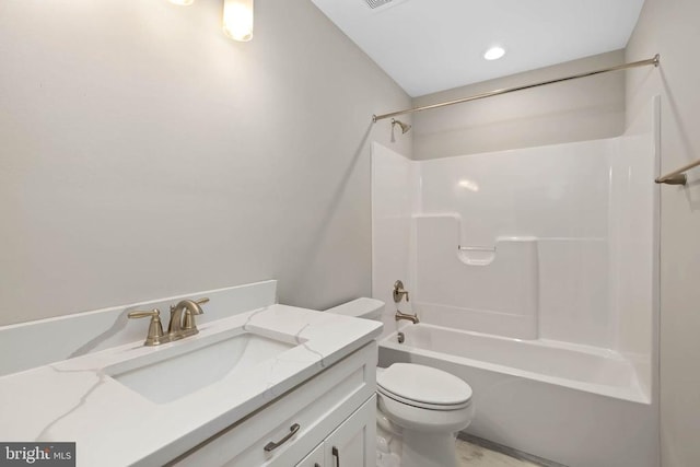 full bathroom with toilet, vanity, and shower / bath combination