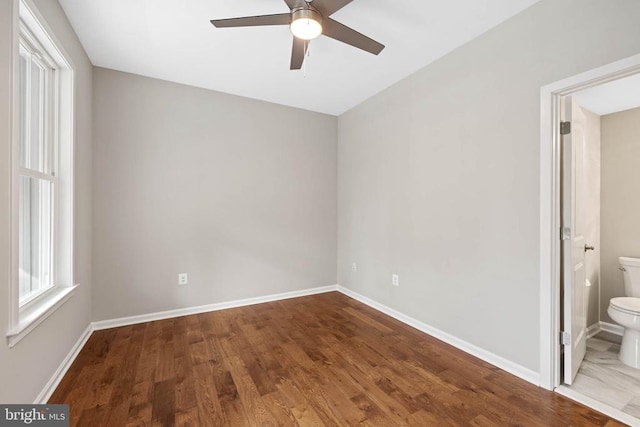 spare room featuring ceiling fan and hardwood / wood-style flooring