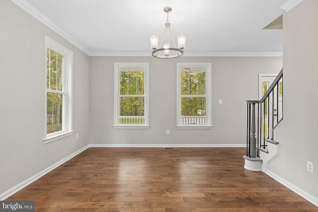 interior space featuring a notable chandelier, dark hardwood / wood-style flooring, and crown molding