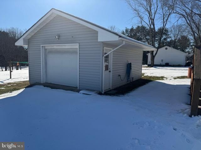 view of snow covered garage