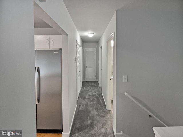 hallway with carpet flooring