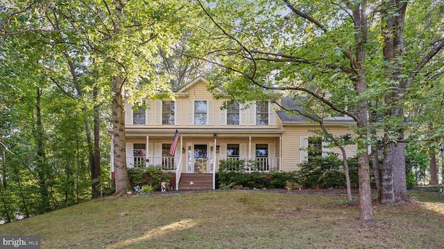 view of front facade with a porch and a front lawn