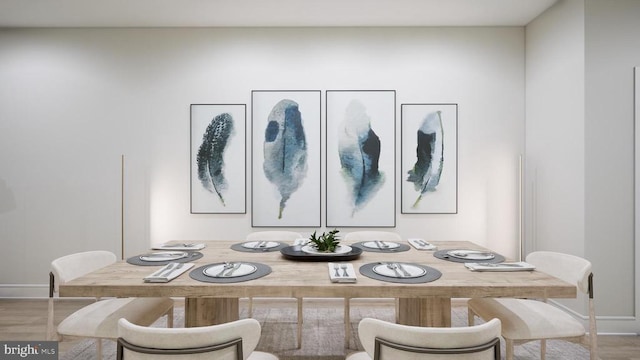 dining space featuring wood-type flooring