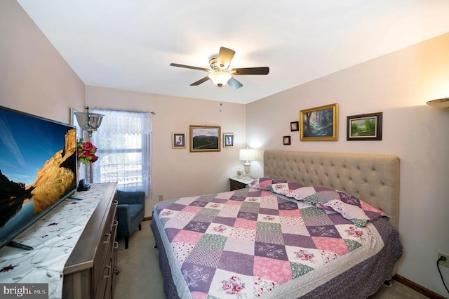 bedroom with ceiling fan and light colored carpet