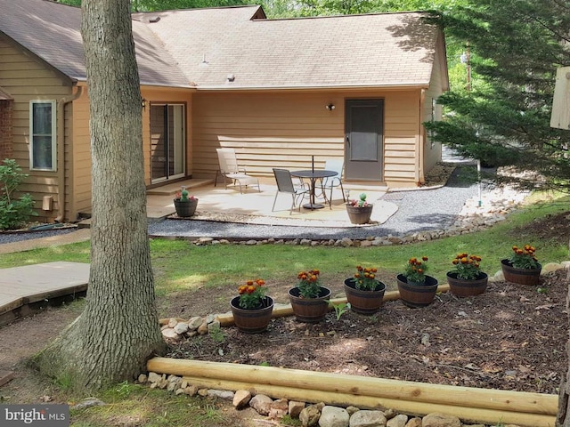 back of house with a patio