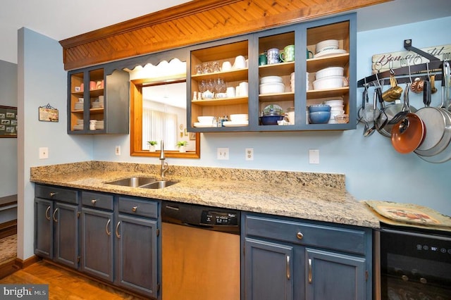 kitchen featuring sink, dishwasher, light stone counters, wood-type flooring, and beverage cooler