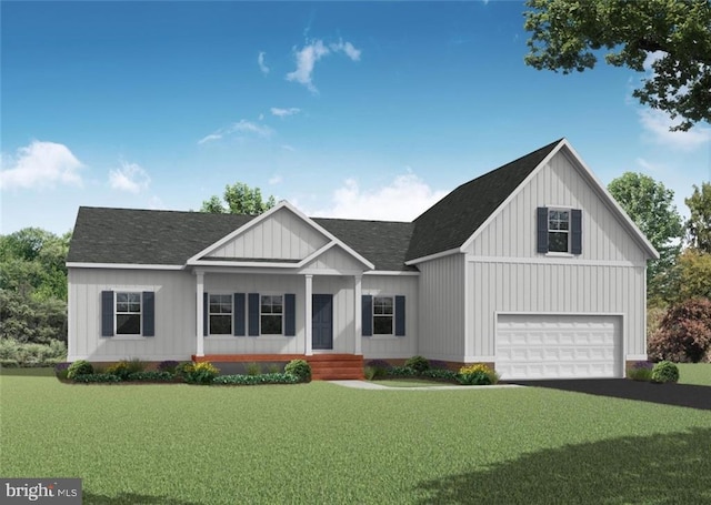 view of front of home with a front lawn and a garage