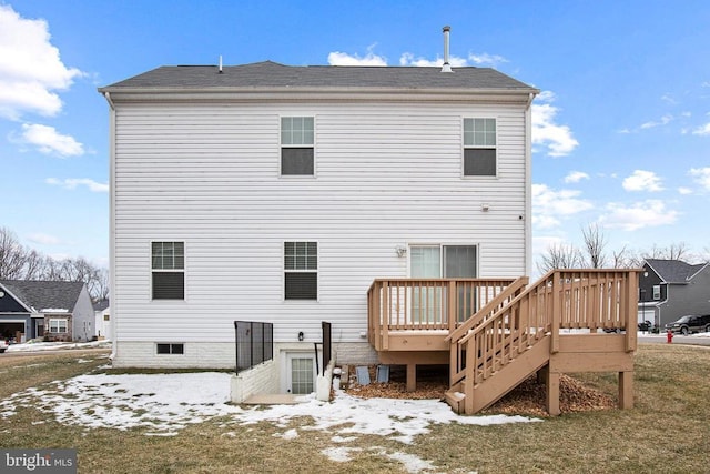 rear view of house with a wooden deck