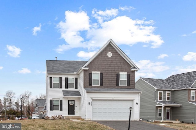 front of property featuring a garage and a front yard