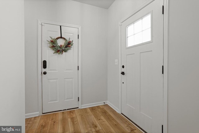 foyer with light wood-type flooring