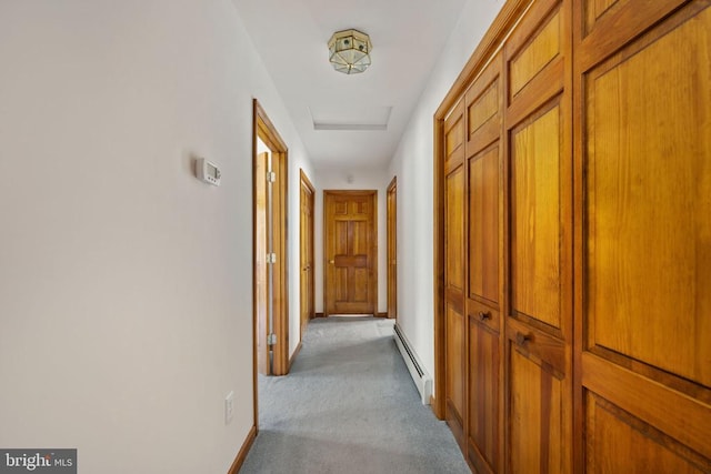 corridor with light colored carpet and baseboard heating