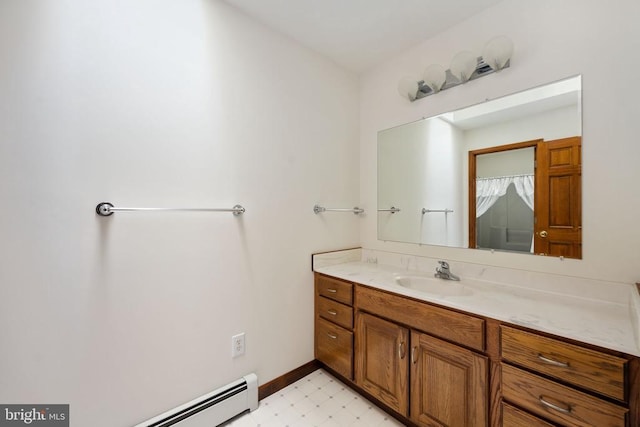 bathroom with baseboard heating and vanity