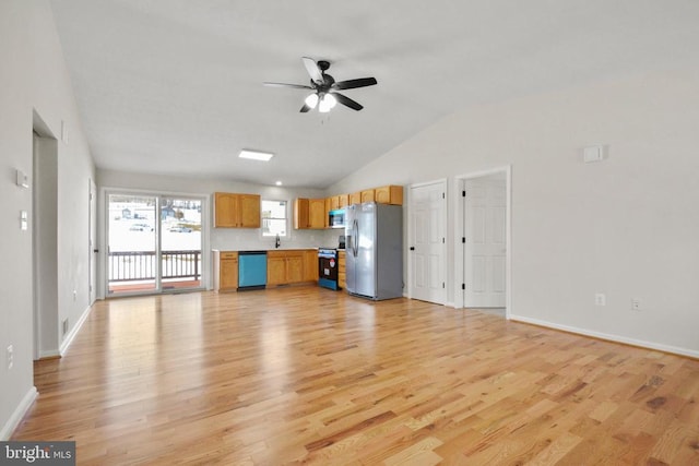 unfurnished living room with lofted ceiling, ceiling fan, sink, and light hardwood / wood-style floors