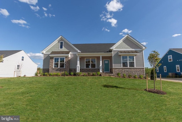 craftsman inspired home with a front lawn