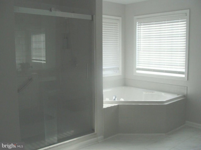 bathroom with separate shower and tub