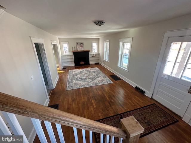 entrance foyer with dark hardwood / wood-style floors