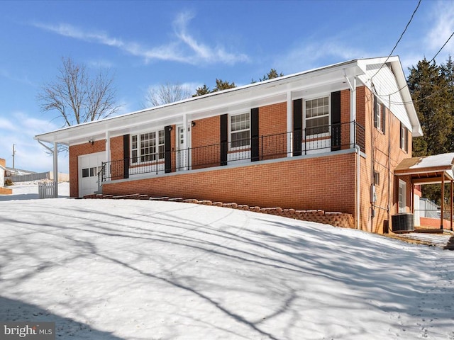 view of front of property with central AC unit and a porch