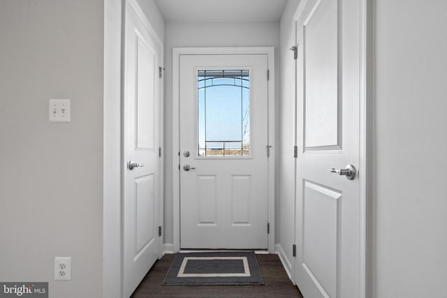 doorway to outside with dark wood-type flooring