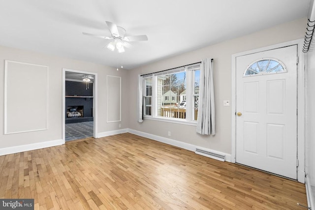 entryway with ceiling fan, light hardwood / wood-style floors, and a wealth of natural light