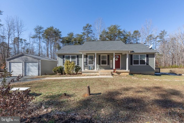 ranch-style home featuring a garage, a front yard, an outbuilding, and covered porch