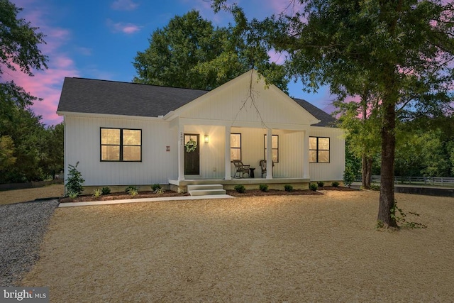 modern farmhouse style home with covered porch