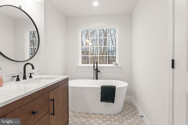 bathroom featuring vanity and a bathtub