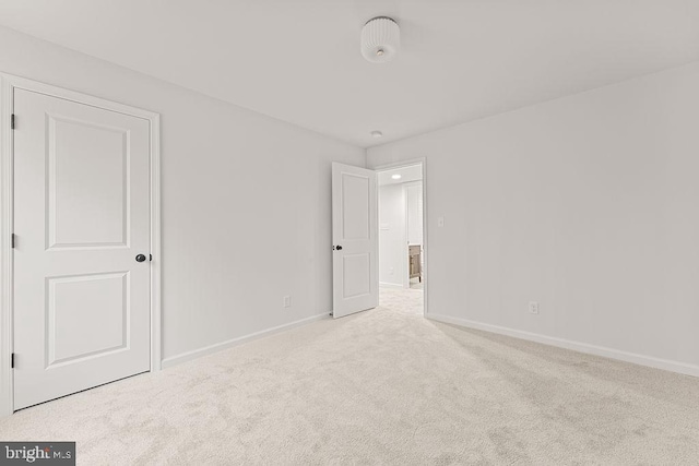 empty room with light colored carpet