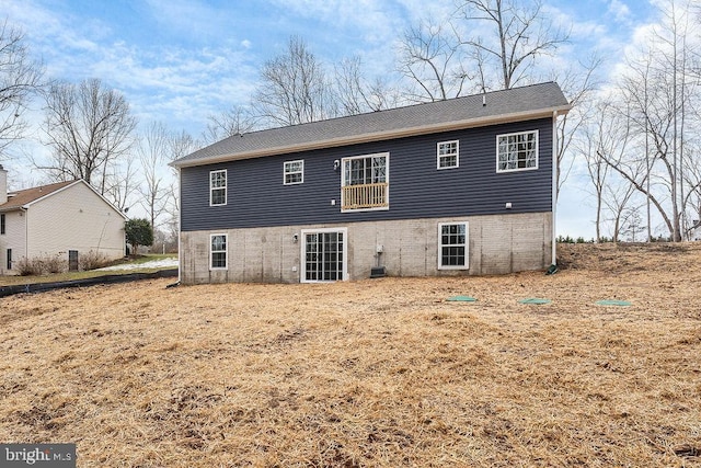 rear view of property featuring central AC