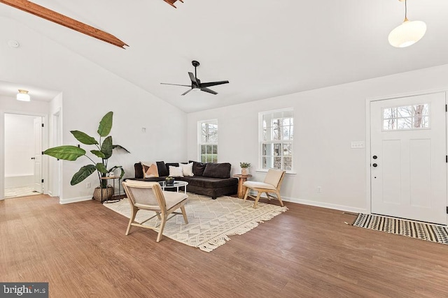 living room featuring ceiling fan, high vaulted ceiling, and light hardwood / wood-style floors