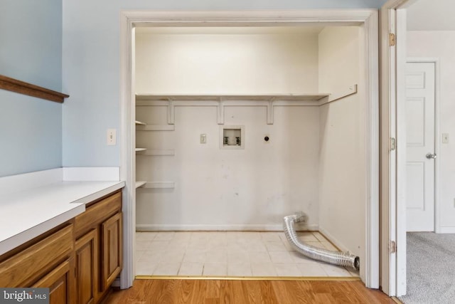 laundry area featuring hookup for a washing machine, hookup for an electric dryer, and light hardwood / wood-style flooring